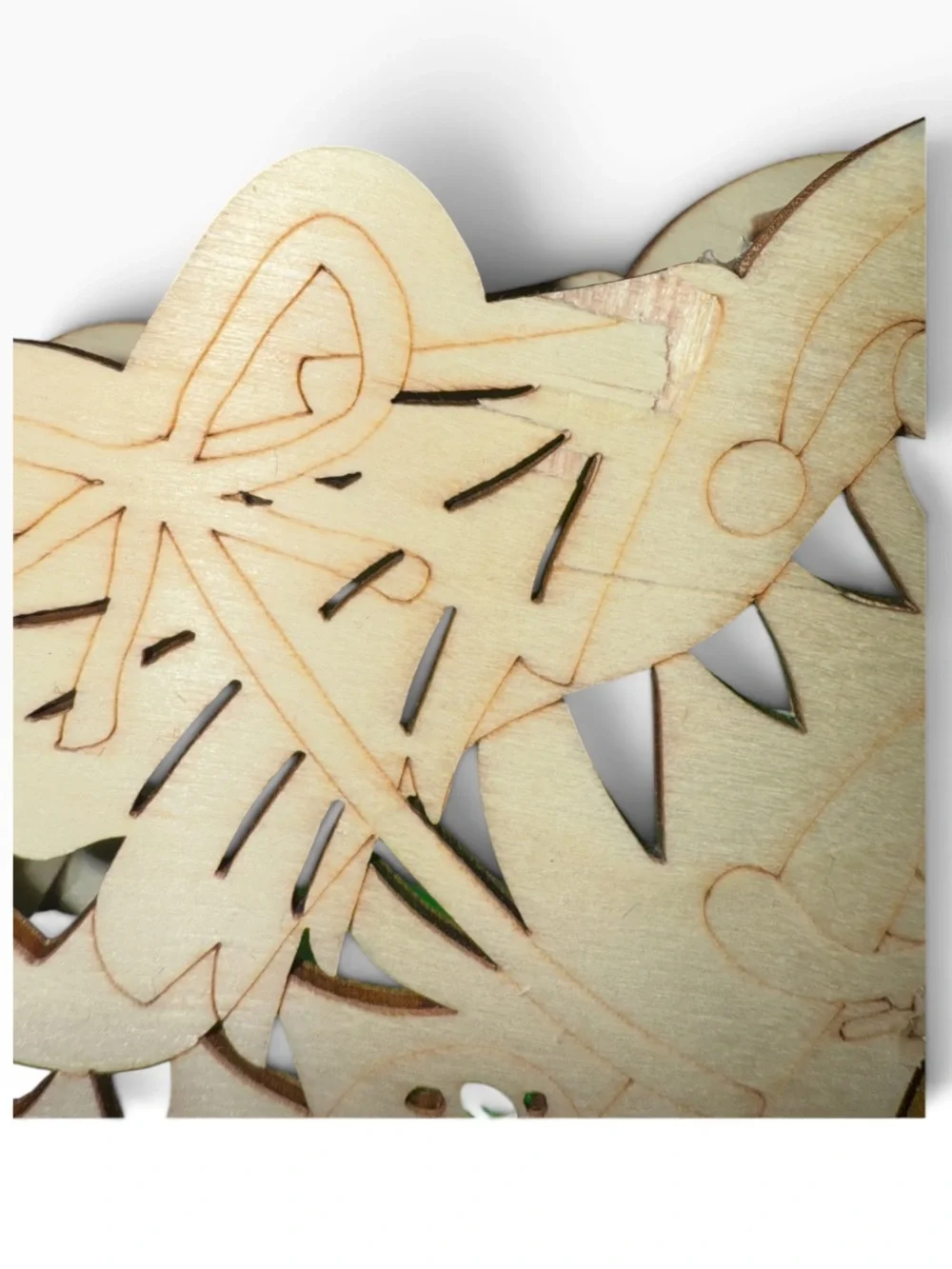 Cut out wood Dino on bike carrying a Christmas tree,